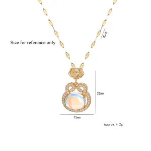 Golden rabbit necklace with iridescent moonstone and zircons on a sequined chain