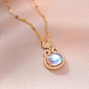 Elegant gold titanium necklace with oval moonstone pendant and sparkling zircon halo