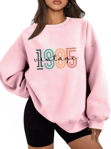 Detail of 1985 vintage pink oversize sweatshirt with thick cotton fabric and ribbed cuffs
