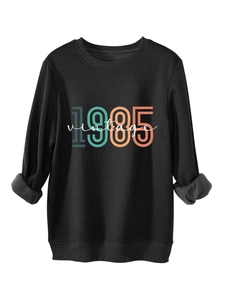 Detail of soft black 1985 vintage sweatshirt showing warm grey fleece lining on the cuff