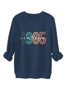 Detail of navy 1985 vintage sweatshirt featuring ribbed crewneck and thick cotton texture