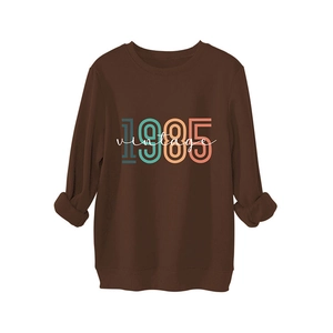 Brown vintage 1985 sweatshirt for women with long sleeves and retro printed design