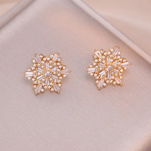 Elegant snowflake stud earrings with rose gold plating and sparkling zircon stones