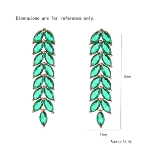 Golden drop earrings with emerald marquise stones in leaf design, size 60mm by 14mm