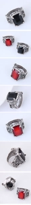 Detailed views of gothic vintage rings featuring rectangular red and black gemstones