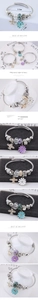 Detail of beaded bracelet with blue daisy and airplane charms, 5.5cm inner diameter