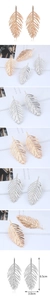 Detail view of retro gold leaf earrings showing fine leaf vein texture and dimensions