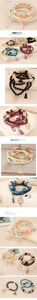 Detailed view of beaded multi-layer bracelet with clover charm and tassel fringe