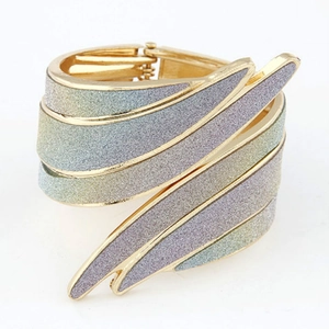 Exaggerated gold wing cuff bracelet with multi-color gradient glitter and spring hinge