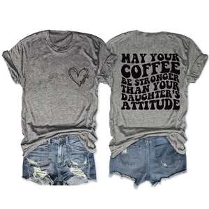 Detail view of grey mom-themed t-shirt with distressed denim shorts featuring ripped hem