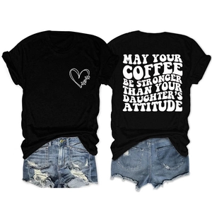 Detail of Mom's black t-shirt with funny coffee quote and ripped denim shorts outfit