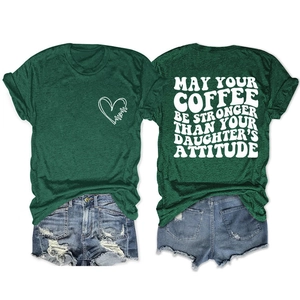Detailed flat lay of casual dark green T-shirt with mom print and distressed denim shorts
