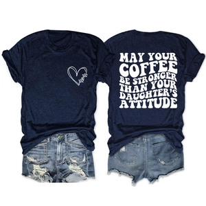 Navy blue t-shirt detail showing white heart and May Your Coffee Be Stronger quote