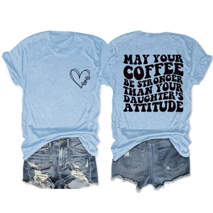 Detail view of cotton t-shirt slogan 'May your coffee be stronger than your daughter's attitude'
