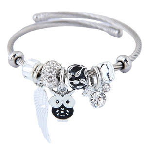 Silver marine owl wings charm bracelet with sparkling rhinestones on steel cable band