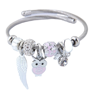 Silver ocean style charm bracelet with pink owl pendants and feather wing charms