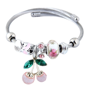 Silver beaded bracelet featuring a pink cherry pendant and faceted crystal charms
