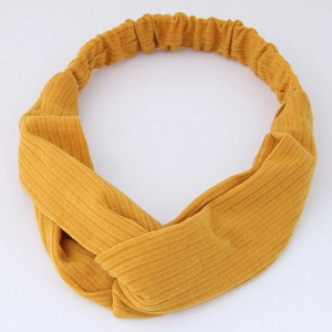 Ginger yellow knitted twist headband with ribbed texture and elastic band for women