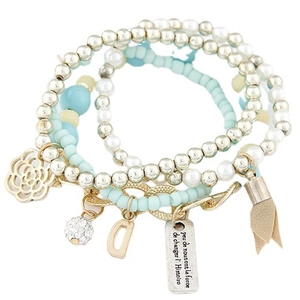 Multi-layer star and moon charm bracelet with blue cat eye beads and silver pendants