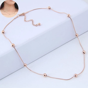 Elegant rose gold bead necklace featuring a minimalist snake chain design with adjustable clasp