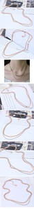 Detailed layered rose gold necklace showing herringbone chain and box chain with extension