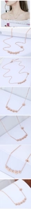Close-up of rose gold five-flower pendant and asymmetric chain on fashion necklace