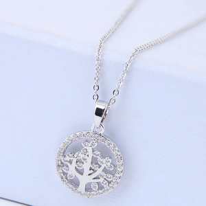 Macro view of silver Tree of Life pendant featuring sparkling pave-set cubic zirconia