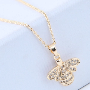 Elegant gold bee pendant necklace with micro-pave cubic zirconia on a minimalist chain
