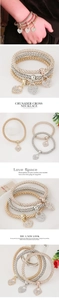 Detailed view of three-piece heart pendant bracelets in gold, silver, and rose gold