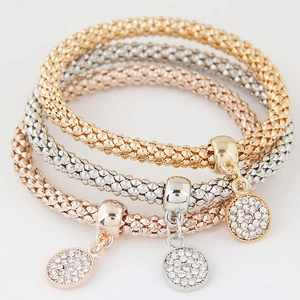 Three-piece stretch beaded bracelet set in gold, silver, and rose gold with zircon charms