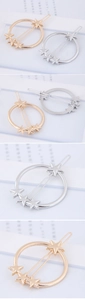 Detailed views of gold and silver minimalist round hair clips with star accents