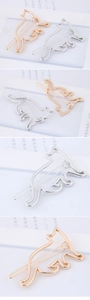 Detailed macro view of minimalist hollow cat metal hair clips in gold and silver finish