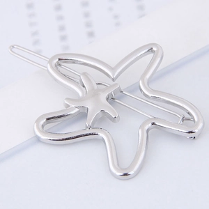 Minimalist silver metal shooting star hair clip with layered hollow star design