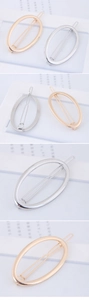 Close-up of high-polish gold and silver oval metal hair clips for daily styling