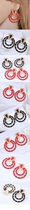 Macro detail of large retro double-circle hoop earrings with colorful rhinestones