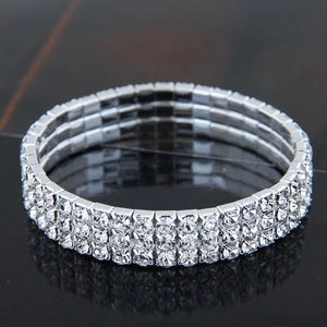Elegant three-row silver elastic bracelet with clear rhinestones and sparkling finish