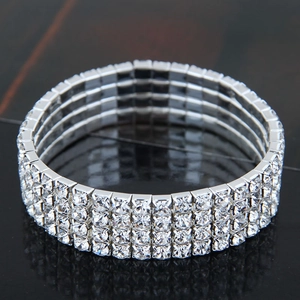 Macro detail of elastic four-row silver crystal bracelet with sparkling white rhinestones