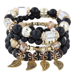 Bohemian multilayer beaded bracelet set with black beads and golden leaf charms