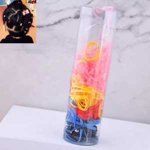 Colorful elastic hair ties set in a clear storage jar for kids hair styling