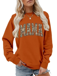 Detailed view of MAMA camouflage print on an orange crewneck sweatshirt for women