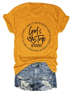 Close-up of yellow Girl's Trip 2026 T-shirt with distressed denim shorts detail