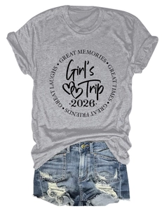 Flat lay of gray cotton T-shirt with Girl's Trip 2026 print and denim shorts