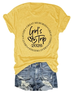 Flat lay of yellow Girl's Trip 2026 T-shirt and distressed denim shorts summer set