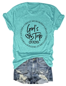 Flat lay of blue Girl's Trip 2026 t-shirt with distressed denim shorts summer outfit set