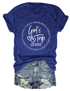 Detail of Girl's Trip 2026 navy t-shirt paired with frayed denim shorts on white background