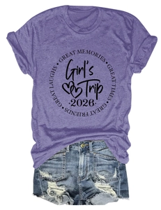 Flat lay of purple short sleeve t-shirt with Girl's Trip print and denim shorts