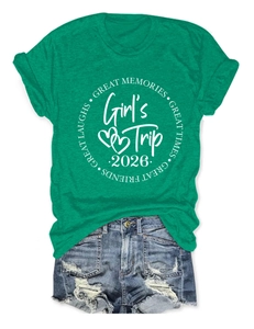 Flat lay detail of green Girl's Trip T-shirt and vintage ripped denim shorts set
