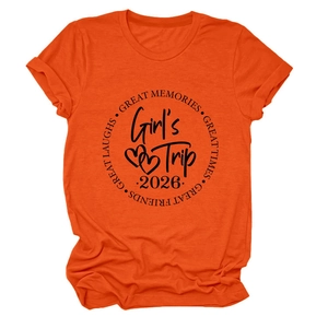Detail of orange crew neck T-shirt with Girl's Trip 2026 print and heart graphics