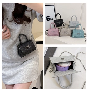 Detailed views of mini glitter crossbody bags with bow accent in five metallic colors