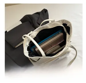 Macro view of white tote bag interior showing spacious storage for tablets and books